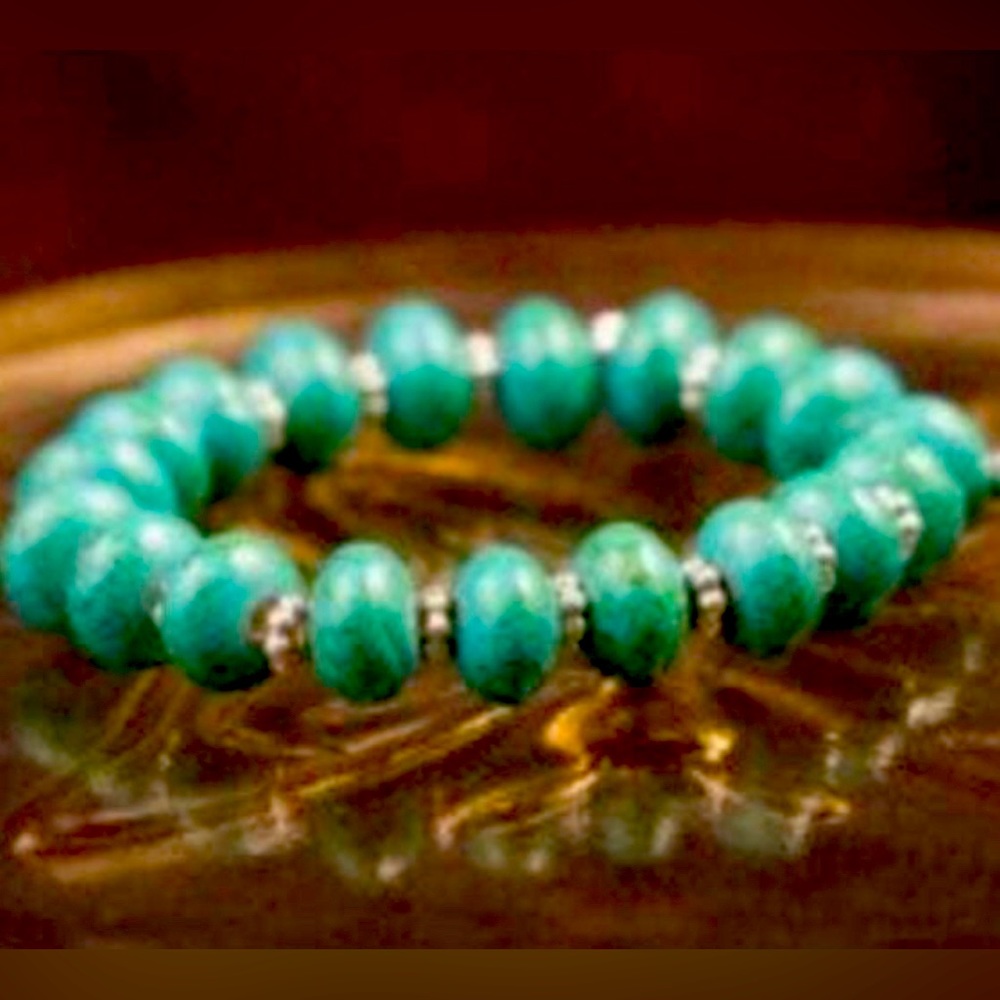 Sasspurilla aqua glass bead and silver bead stretch bracelet